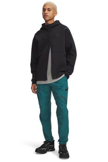 UNDER ARMOUR Petrol-coloured trousers