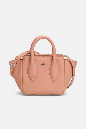 LACOSTE Handtasche 'Daily City' lachs