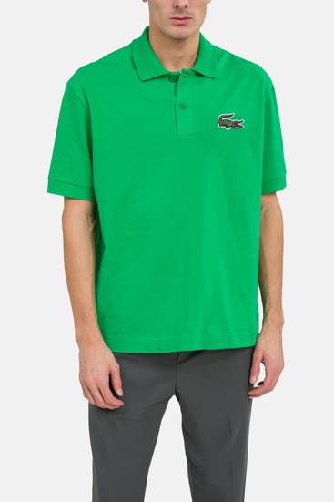 LACOSTE - Polo-Shirt grün unisex