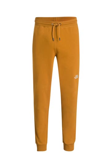 THE NORTH FACE Sweatpants gelbbraun