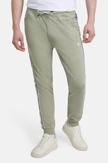 GUESS - Sweatpants graugrün
